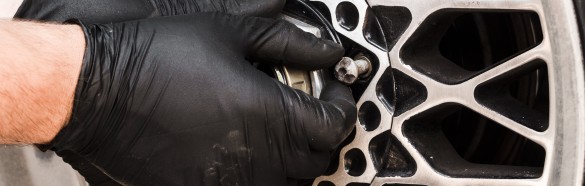Close Up Man Swapping Wheel (1)
